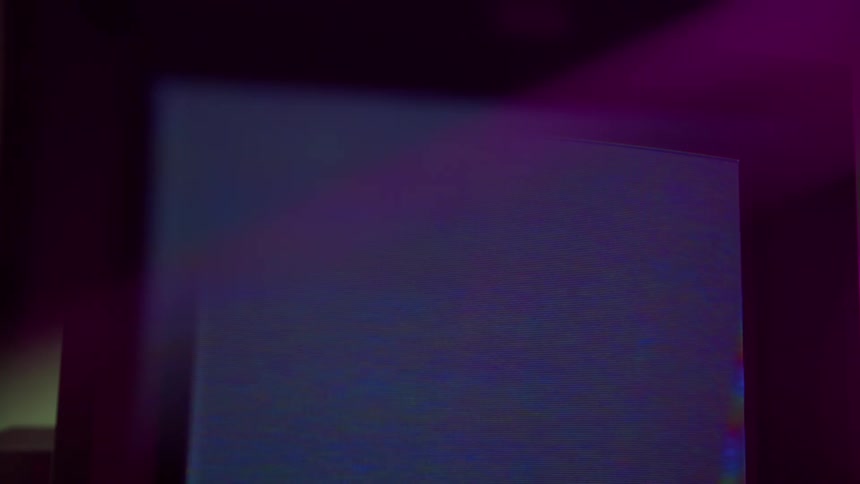 The television screen is flickering with static