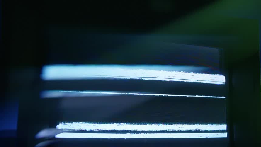 A screen on a television is flashing with static