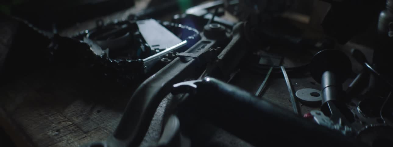 Tools and car parts on table at the garage