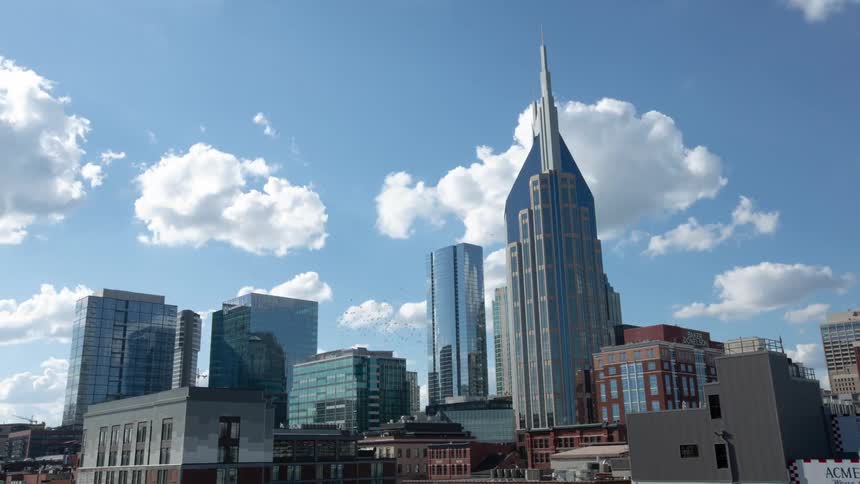 Tall skyscrapers reflect blue of sky