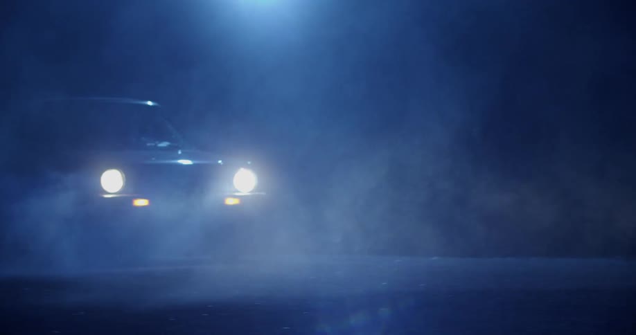 A car driving outdoors at night
