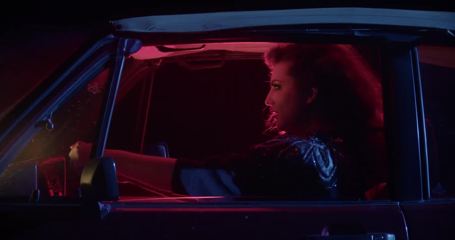 Woman driving car screams staring with wide eyes