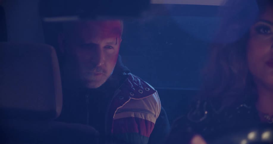 A man and woman in a car driving together