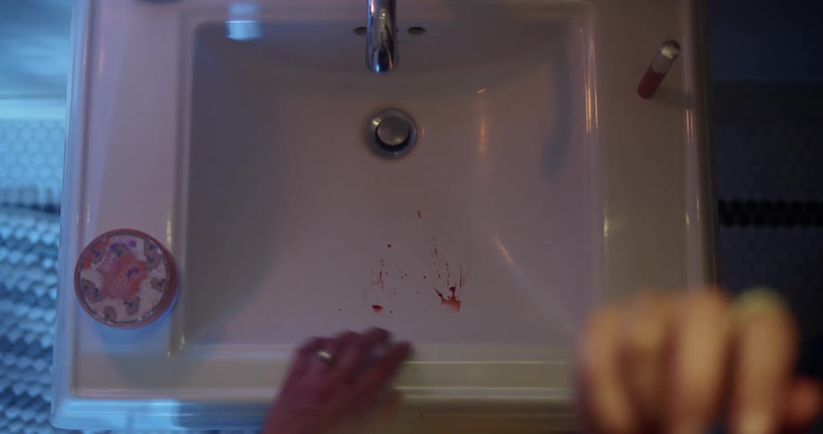 Blood falling into sink