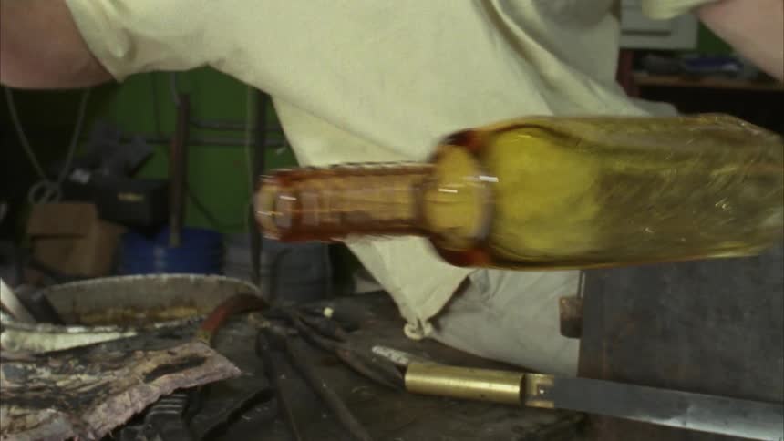 A man is spinning glass
