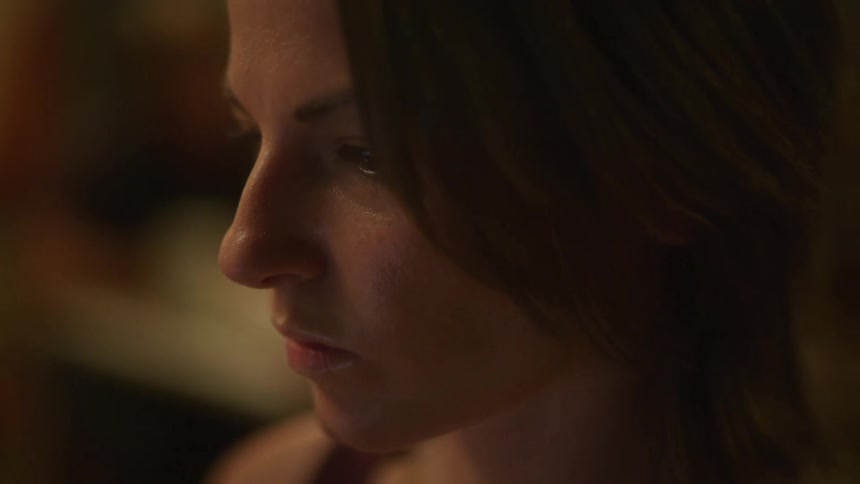 A close up portrait of a dark haired woman