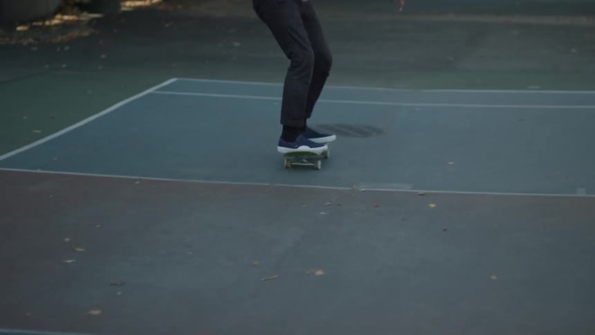 A man flips his skateboard