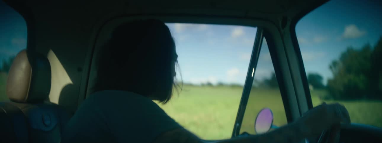 A woman doing doughnuts in a field