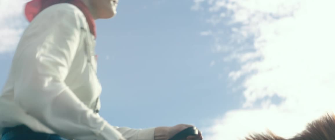 A person is riding a horse outdoors during the day