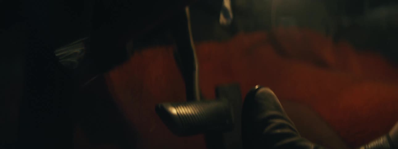 The camera shakes considerably as a person rapidly brakes and then accelerates their vehicle