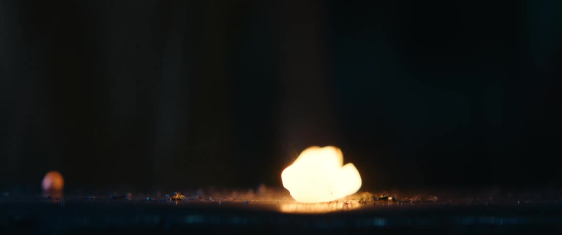 A blacksmith is hammering a piece of red hot metal