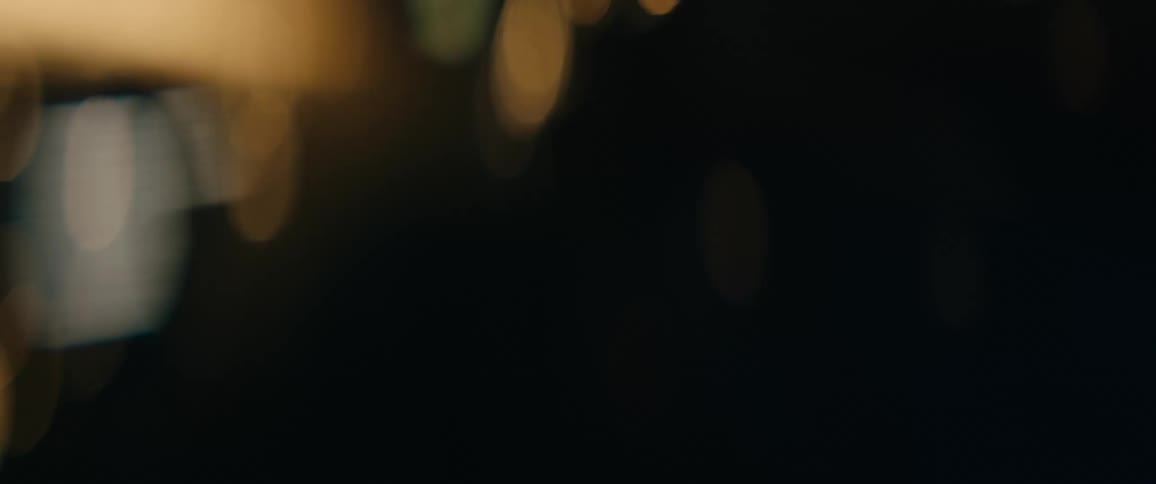 Bright lights shine and flash outside at night