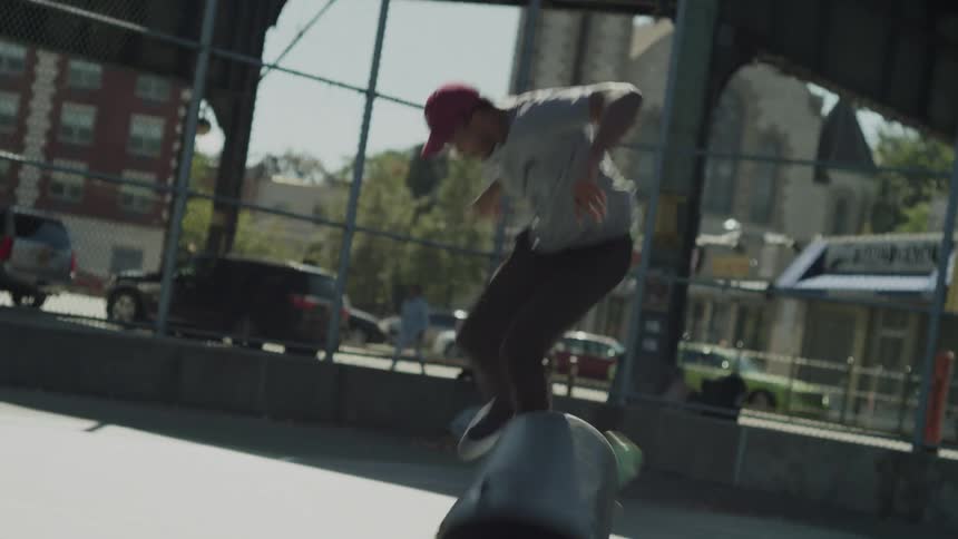 A main fails to jump over a garbage can with his skateboard