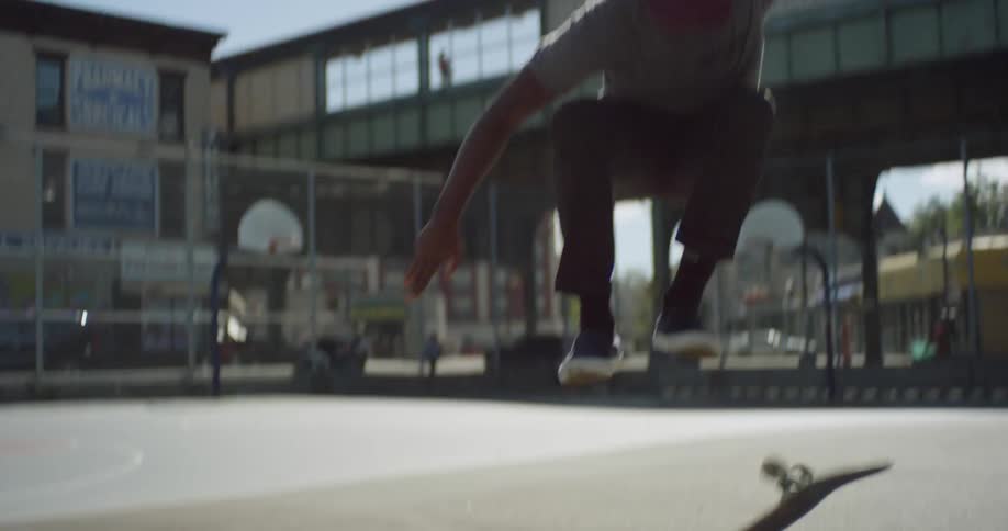 A man does a jump on a skateboard