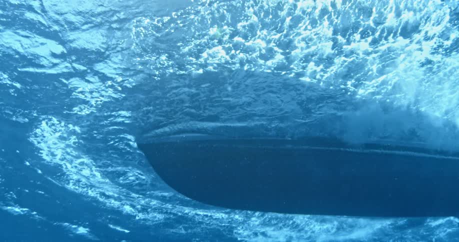 View of the bottom of a boat floating on the ocean