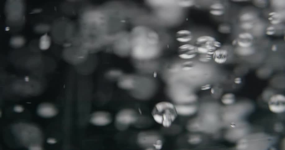 Water is pouring and filling a glass