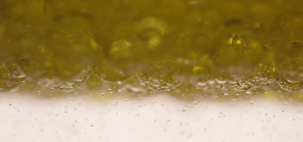 Yellow liquid bubbles and moves around