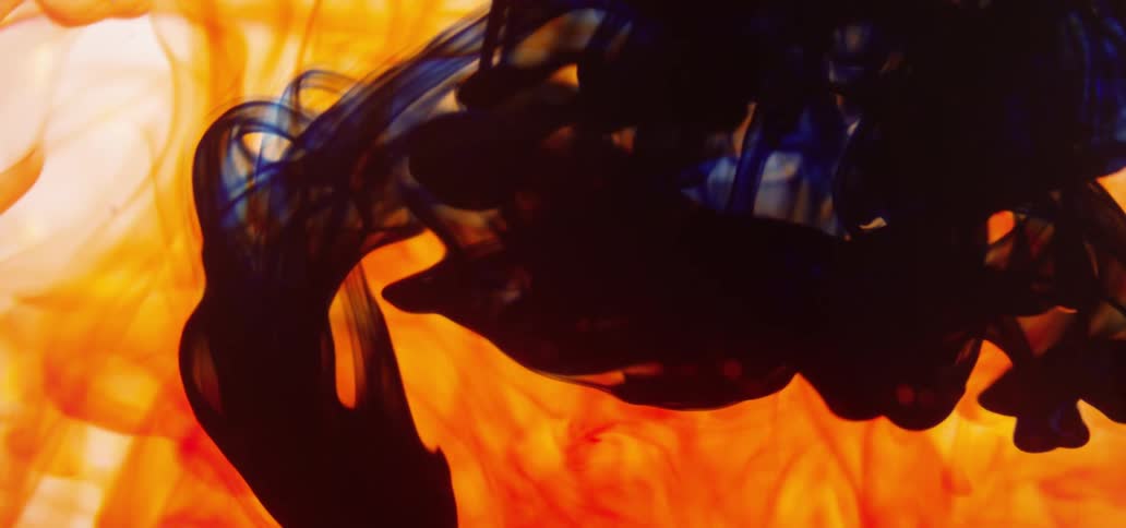 Blue and orange fluid swirling around