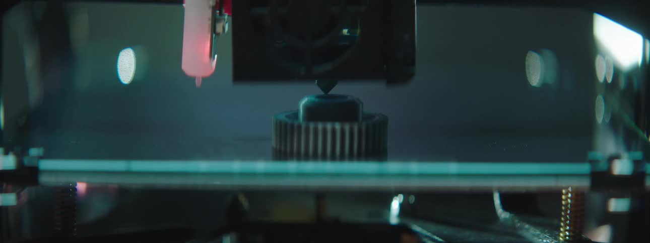 A 3d printer adds a layer to an object and lifts up