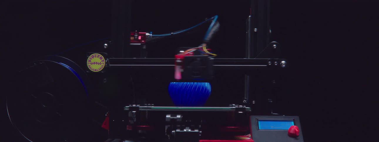 A machine is fabricating an item