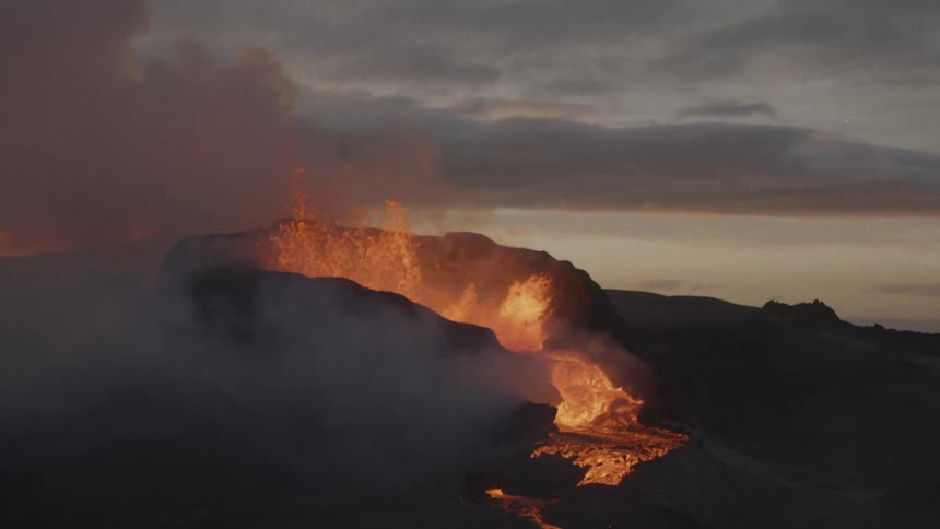 A volcano with smoke and molten lava with the sky and clouds in the background