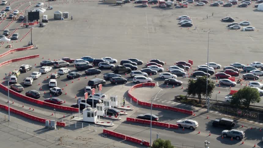A view of cars turning into a parking lot