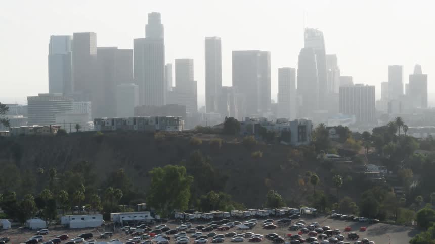 A view of a parking lot near a city