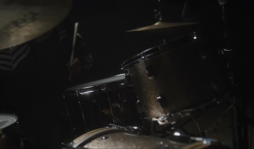 A musician plays the drums