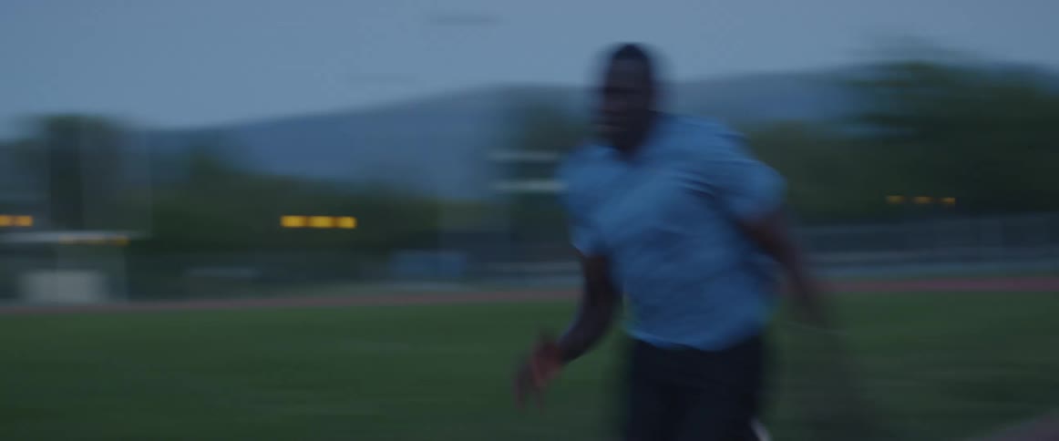 A man runs down the race track