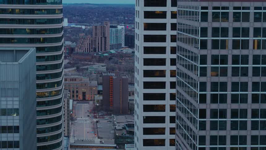 Skyscrapers in the city with vehicles on the street below