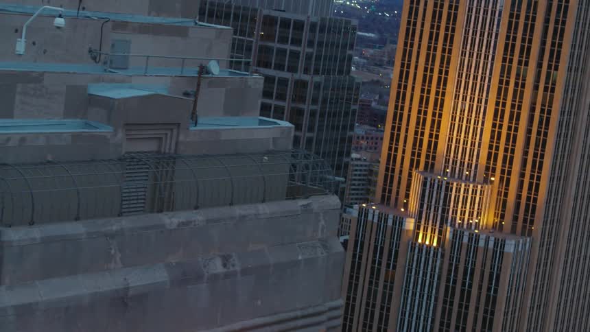 The buildings have lit words on the top