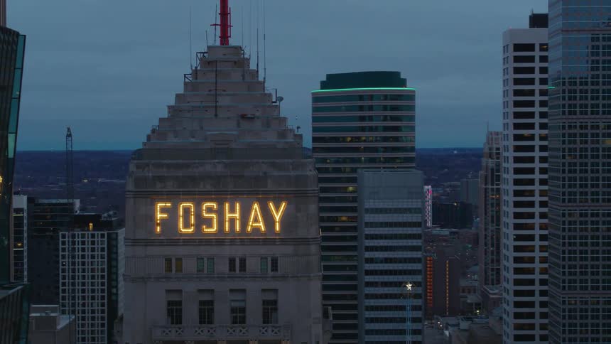 The foshay tower with name in lights downtown at dusk