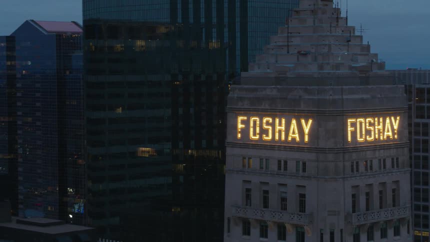The foshay tower and surrounding buildings in minneapolis with lights glowing