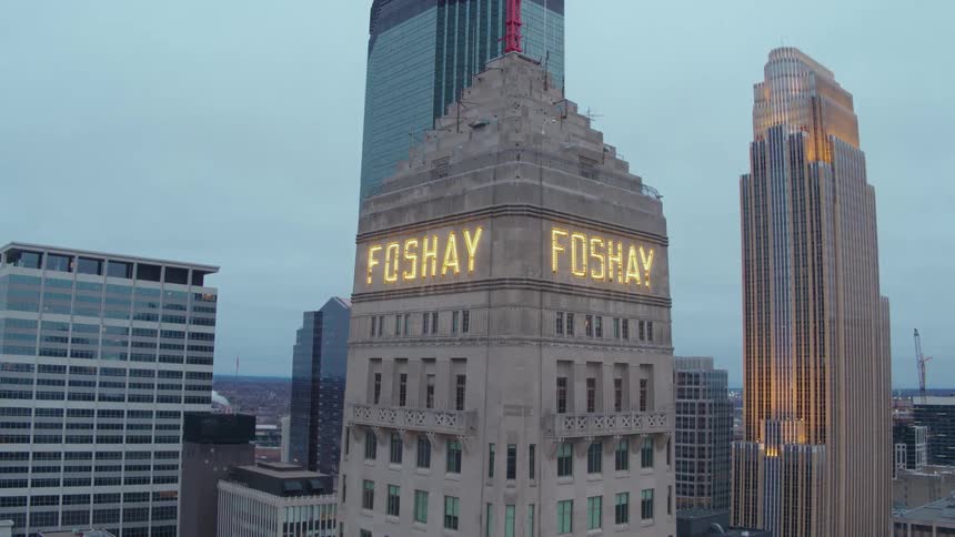 A lighted sign is on the top of the building