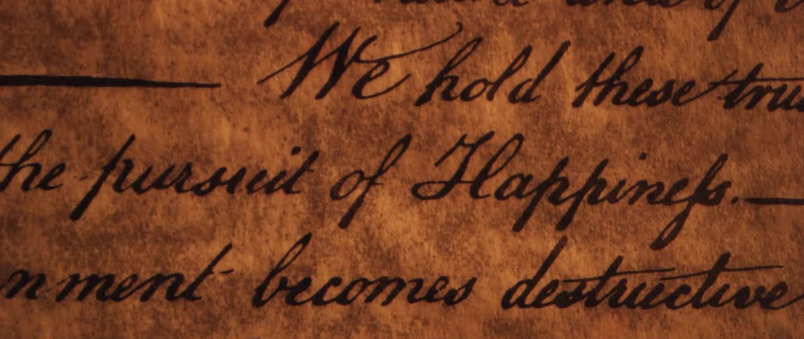 Light brightens over close up of united states constitution text