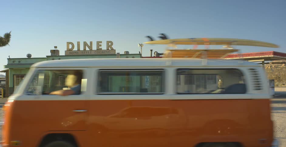 Van drives past a diner out in the country