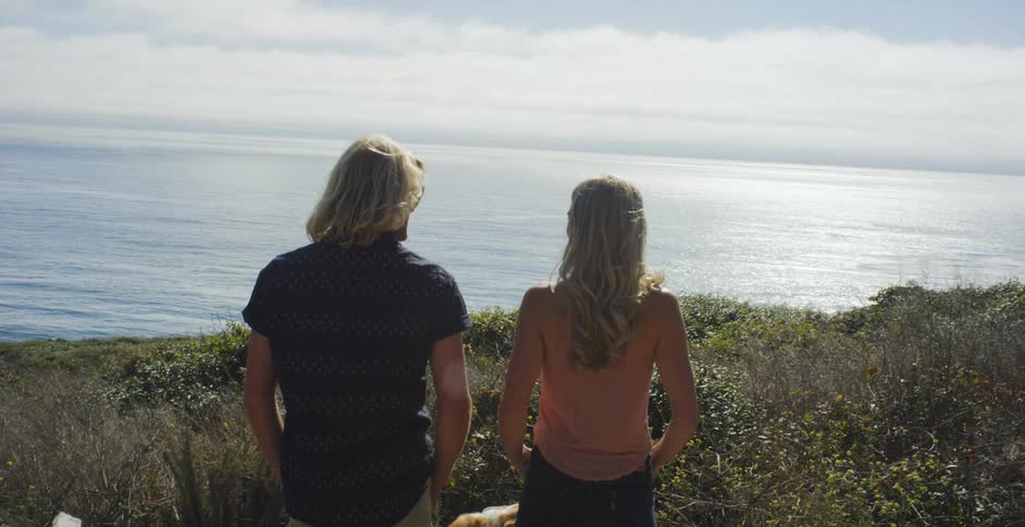 Man and woman looking out across the water