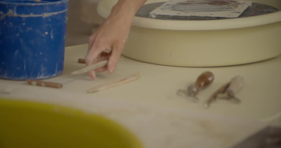 Clay-working tools are sat down on a table