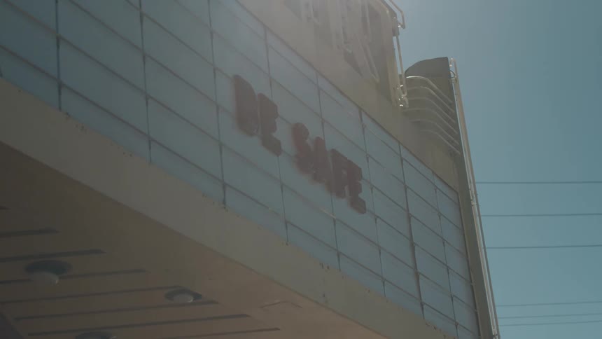 The marquee outside a movie theater advises people to stay safe