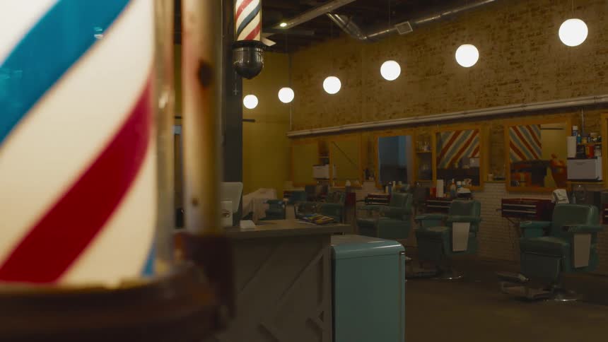 The barbershop is empty with spinning signs