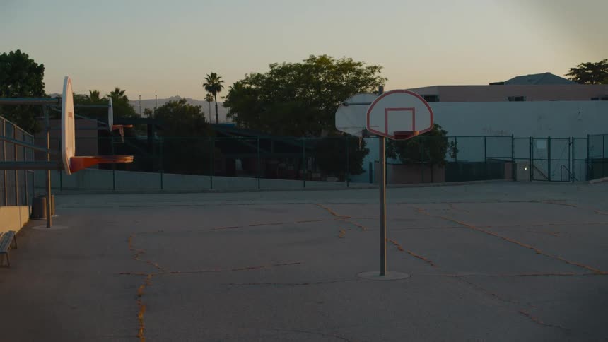 Basketball hoops on a public park at evening