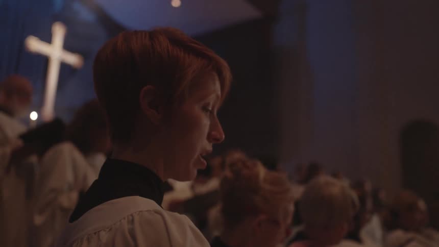 A choir is performing in a church