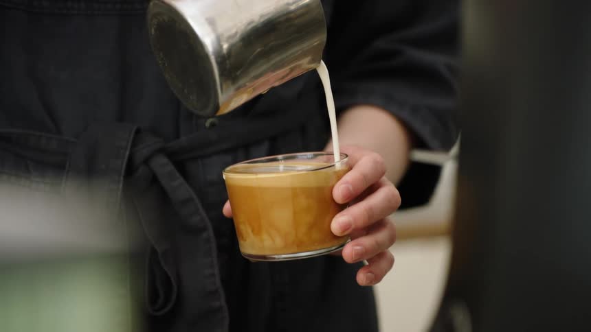 Person pouring milk