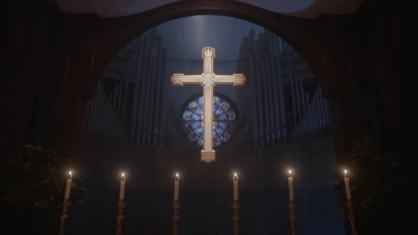 Illuminated cross in an empty shrine area