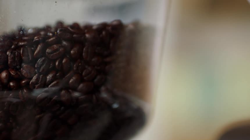 A view of coffee beans in a grinder