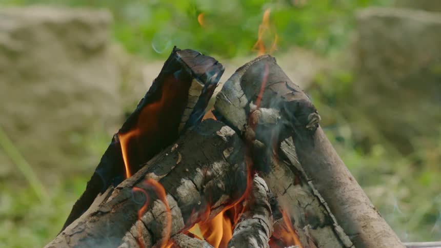Smoke rises from a burning bonfire