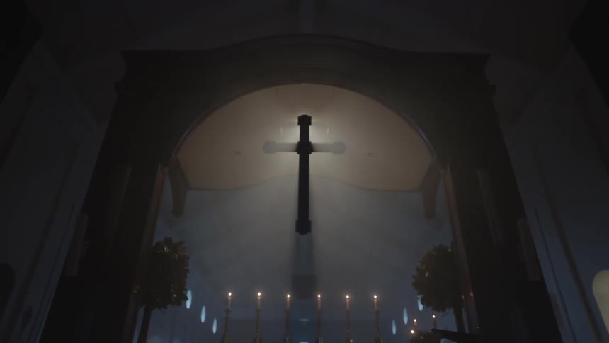 Sunlight behind a cross in a church