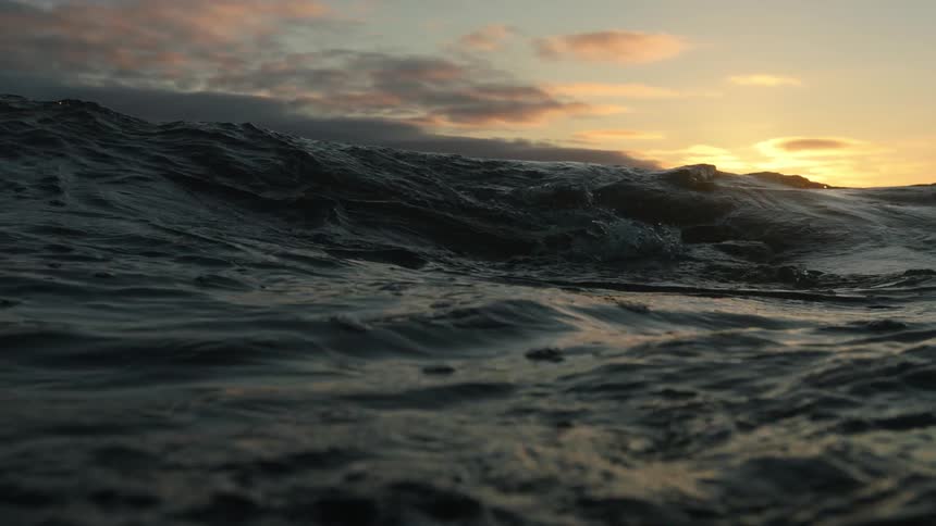 Waves form at sunset