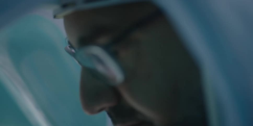 Two doctors talking with each other in a room