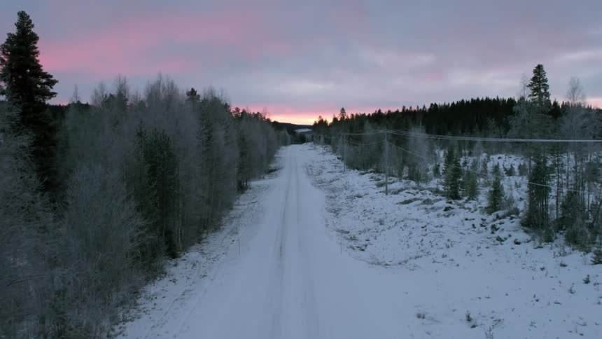 Aerial view of a snow covered road